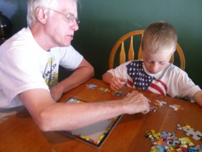 Working a puzzle with Grandpa